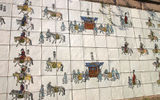 Some of the more than 2,500 figures that appear on a 630-foot ceramic painting, the world's largest, in downtown Seoul. The painting represents King Jeongjo's Procession, an eight-day 18th century journey to his father's tomb, and adorns a wall on one side of Cheonggye Stream. The city recently created a park with the below-street-level stream, a former drainage canal, as the centerpiece.
