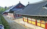 The brightly painted Daebiro Hall, seen in the foreground, at Haeinsa Temple in the mountains south of Seoul. The main hall for services, seen in the rear, carries this name: Daejeokgwangjeon.