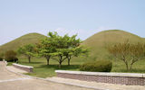 Grass-covered burial mounds seen in the Daereungwon Tomb Complex in Gyeongju, a former capital of Korea. There are 155 such mounds in the city's downtown.