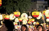 Celebrating with lanterns, marchers hold the pieces aloft during the Lotus Lantern Festival's closing night parade in Seoul this spring.