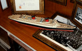 The Midship’s Bar will have three cases of memorabilia related to the original Queen Elizabeth liner, such as an original 1938 invoice from the shipbuilder, and a radiogram a passenger sent to the ship in 1946.