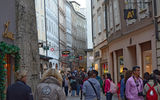 Continuing on the walk through Salzburg, participants walk down the Getreidegasse, Salzburg's famous shopping lane.