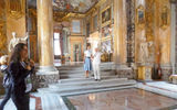 A stand-in for Audrey Hepburn appeared to pose with the group for the tour's official portraits, taken in the grand hall.