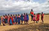 The Maasai typically welcome visitors with singing and jumping displays. These villagers live near Amboseli National Park in southern Kenya.