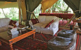 The lounge, with dining space at the rear, in the main tent at Mara Toto, a Great Plains Conservation property just inside the Maasai Mara National Reserve.