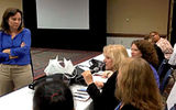 Moderators Joanie Ogg (with microphone) and Mary Pat Sullivan (standing) during the Think Tank session. TW photo by Kate Rice
