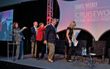 The entrance of the panelists on the “Which Host Model Fits Your Business Plan” session, from left: moderator Mary Pat Sullivan, Dwain Wall of Cruise One/Cruises Inc., Jackie Friedman of Nexion, Scott Koepf of Avoya and Michelle Fee of Cruise Planners/American Express.