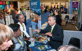 Wayne Peyreau of MSC Cruises chats with delegates on the trade show floor.