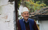 A Prizren man greets visitors.