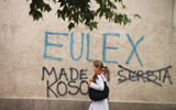 A Kosovar wants to make it clear that this turf is now Kosovo and not Serbia. This sign was painted on a wall in Prizren.
