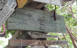 Signs made by guests adorn The Outhouse restaurant at Grand Pineapple Beach