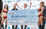 Roger Daltrey, lead singer of the Who, accepts a check from Fremont Street Experience President Jeff Victor for Teen Cancer America, a charity inspired by Daltrey and his bandmate Pete Townshend, in Downtown Las Vegas. The Who is the subject of the latest Viva Vision light-and-sound show at the Fremont Street Experience; “The Who – Miles Over Vegas,” will be built around three of the band’s biggest hit songs, “My Generation,” “I Can See for Miles” and “Pinball Wizard.”
