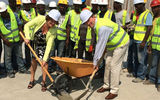 At the topping-off ceremony at the new Marriott Hotel Port-au-Prince in Haiti, scheduled to open in early 2015, are, from left: Ineke Botter, CEO of Digicel Haiti (with shovel) and Andrew Houghton, Marriott International's area vice president, Caribbean and Latin America, surrounded by the Marriott Port-au-Prince construction crew. Digicel Group is designing and building the hotel; Marriott International's Marriott Hotels & Resorts brand is the operating partner under a long-term management contract.