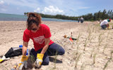 Paula Brabants of Tourism Cares plants seagrasses at Virginia Key Park on Miami’s Biscayne Bay, a 1,000-acre barrier island of wetlands, sea-grass beds, tidal and mud flats and home to the landmark Miami Marine Stadium. A total of 325 travel and tourism executives from 29 states, four countries, and 83 companies donated their time and energy to the clean-up and restoration of the park and the abandoned stadium, which was built in 1963 and hosted powerboat races, political rallies and concerts by Jimmy Buffett and others.
