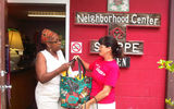 Dorothy Kopp, right, Travel Leaders Corporate, delivers food to the Neighborhood Center in Orlando as part of Travel Leaders Group's first Day of Giving in July. Travel Leaders Group members donated 2.7 tons of groceries and $34,000 to food banks nationwide. One hundred fifty-nine volunteers put 285 hours into the effort.