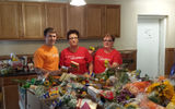 Travel Leaders Group held its second annual Day of Giving.  Participating Travel Leaders members, franchisees and clients collected 3.67 tons of groceries and donated $50,000 to local food banks or Feeding America. From left, Joe Deliberto, Kim Collins and Michelle Meyer, Travel Leaders Corporate of St. Louis.