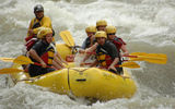 This photo and the two that follow were taken within the same 60 seconds. In the first photo, the author, Nadine Godwin, is at the back among rowers on the right, invisible in the second photo and visible again in the third. The group was traversing Class III rapids. Photos by Fernando Torres, Adventuras Photographicas