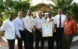 Jesson Church, Ryan Hopkin, Fabian Mitchell, Royston Hopkin, Wendy Charles, Brian Hardy and Seymour Thompson celebrate Spice Island Beach Resort receiving its Green Globe Certification Award.