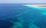 Experience Umluj and its Islands. Saudi Arabia's coastal destinations are both underrated and underexplored, which is surprising given the allure of these golden sand beaches and turquoise blue waters. Umluj is one such example, drawing comparisons to the Maldives. North of this coastal town, visitors will discover more than 100 small islands celebrated for their egg-white sands and ancient palm trees.