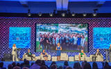 The Commissions with Commas panel featured Meredith Hill of Gifted Travel Network, speaking, and seated, from left: Jackie Friedman of Nexion, Debbie Fiorino of CruiseOne and Cruises Inc., Michelle Fee of Cruise Planners, an American Express Travel Representative, and Van Anderson, Avoya Travel, an American Express Travel Representative.