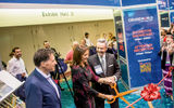 Dondra Ritzenthaler of Celebrity Cruises wielded the scissors to cut the ribbon to officially open the exhibitor showcase with Travel Weekly Editor in Chief Arnie Weissmann, left, and Publisher Bruce Shulman.