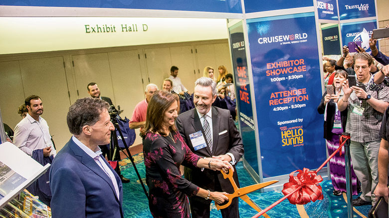 Dondra Ritzenthaler of Celebrity Cruises wielded the scissors to cut the ribbon to officially open the exhibitor showcase with Travel Weekly Editor in Chief Arnie Weissmann, left, and Publisher Bruce Shulman.