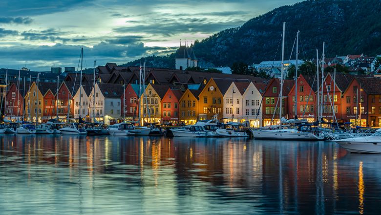 View of Vagen harbor at dusk in Bergen, Norway
