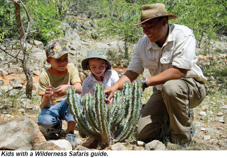 Kids with a Wilderness Safaris guide.