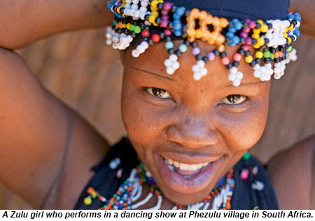 A Zulu girl performs in a dancing show at Phezulu village in South Africa.