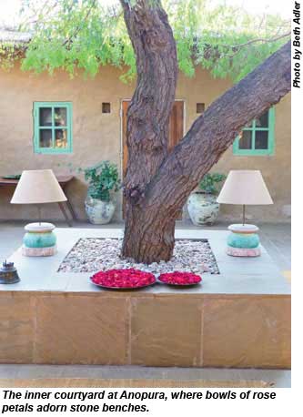 The inner courtyard at Anopura, where bowls of rose petals adorn stone benches.