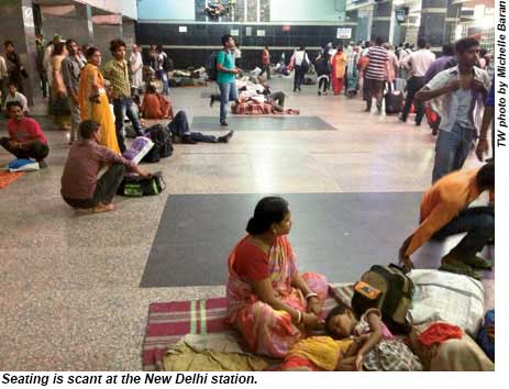 Seating is scant at the New Delhi station.