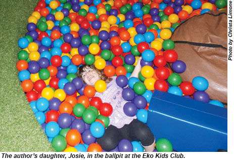 Josie in the ballpit at the Eko Kids Club.