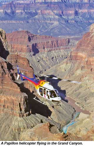 A Papillon helicopter flying in the Grand Canyon.
