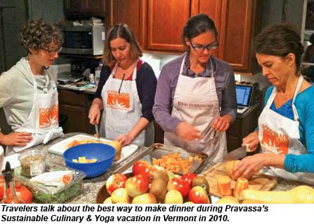 Travelers talk about the best way to make dinner during a Pravassa Sustainable Culinary and Yoga vacation in Vermont in 2010.