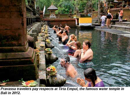 Pravassa travelers pay respects at Tirta Empul, the famous water temple in Bali in 2012.