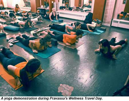 A yoga demonstration during Pravassa Wellness Travel Day.