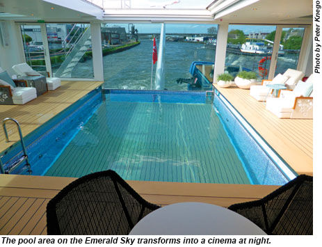 The pool area transforms into a cinema at night.