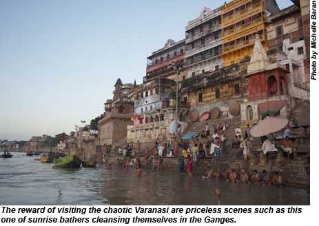 Sunrise bathers cleansing themselves in the Ganges.