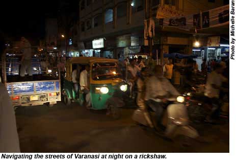 Navigating the streets of Varanasi at night on a rickshaw.