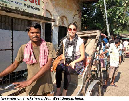 The writer on a rickshaw ride in West Bengal, India.