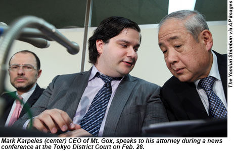 Mark Karpeles of Mt. Gox speaks with his attorney in Tokyo.