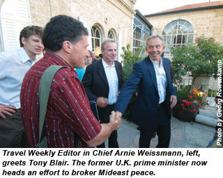 Arnie Weissmann greets Tony Blair