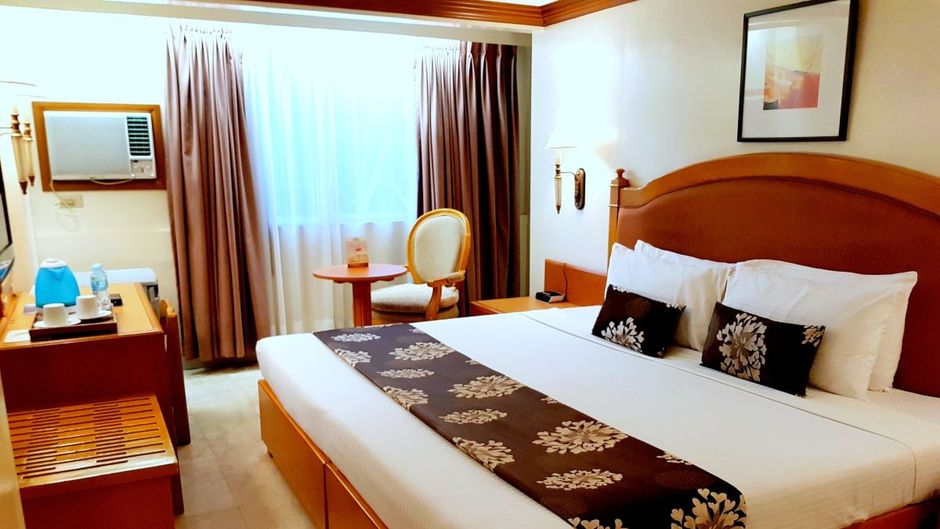 Palm Grove Hotel Room