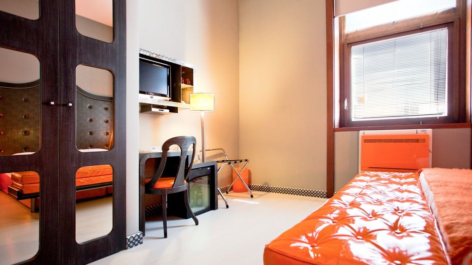Orange Hotel Room