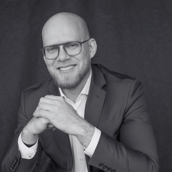 Andrzej Kozlowski President of the Board & CEO
