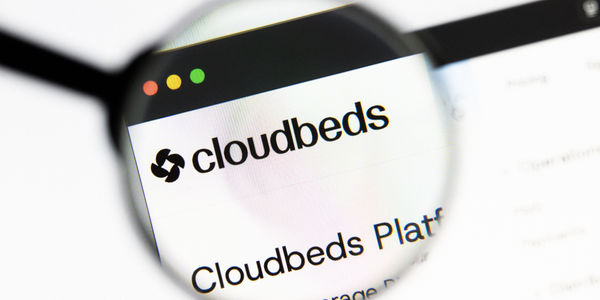 Milan, Italy 2026, 20 Apr Closeup of cloudbeds website on a laptop screen. Focus on cloudbeds logo under a magnifying glass.