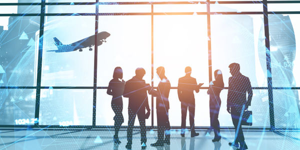 Silhouettes of business people in panoramic office with double exposure of blurry network interface. Concept of business meeting and internet. Toned image