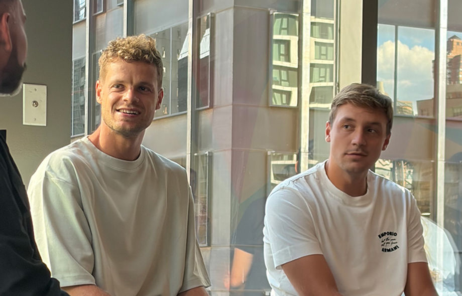 tennis players Yannick Hanfmann and Hamad Medjedovic answering questions on a panel