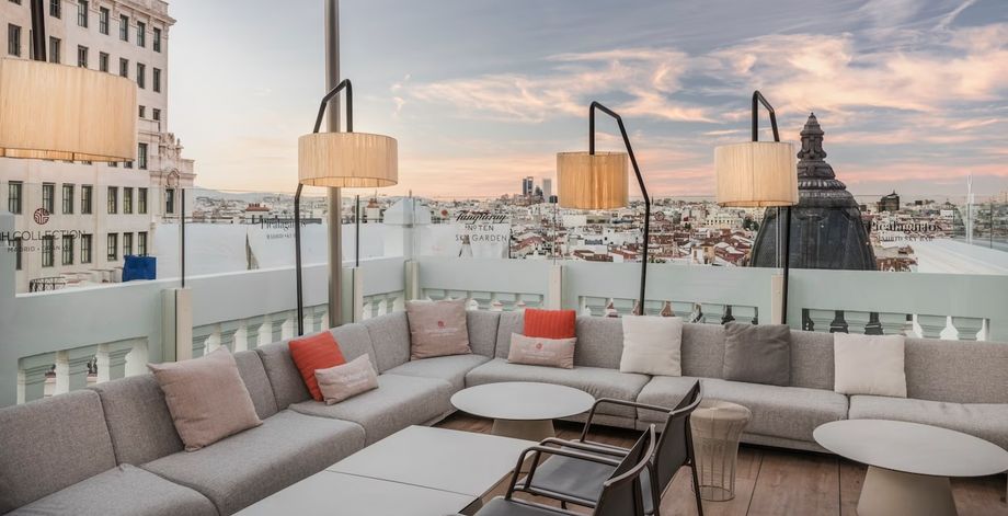 NH Collection Collection Madrid Gran Vía's rooftop lounge overlooking the city skyline. NH Collection Collection Madrid Gran Vía's rooftop lounge overlooking the city skyline.