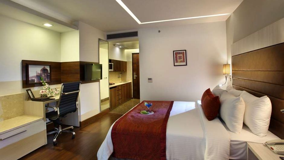 Mahagun Sarovar Portico Room